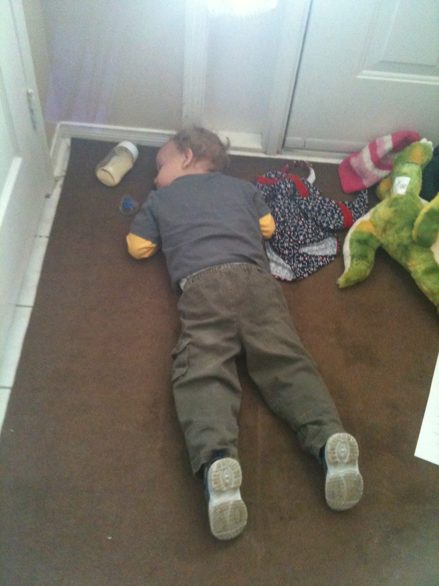 A very tuckered little man, couldn't even make it from the door to his bed, LOL