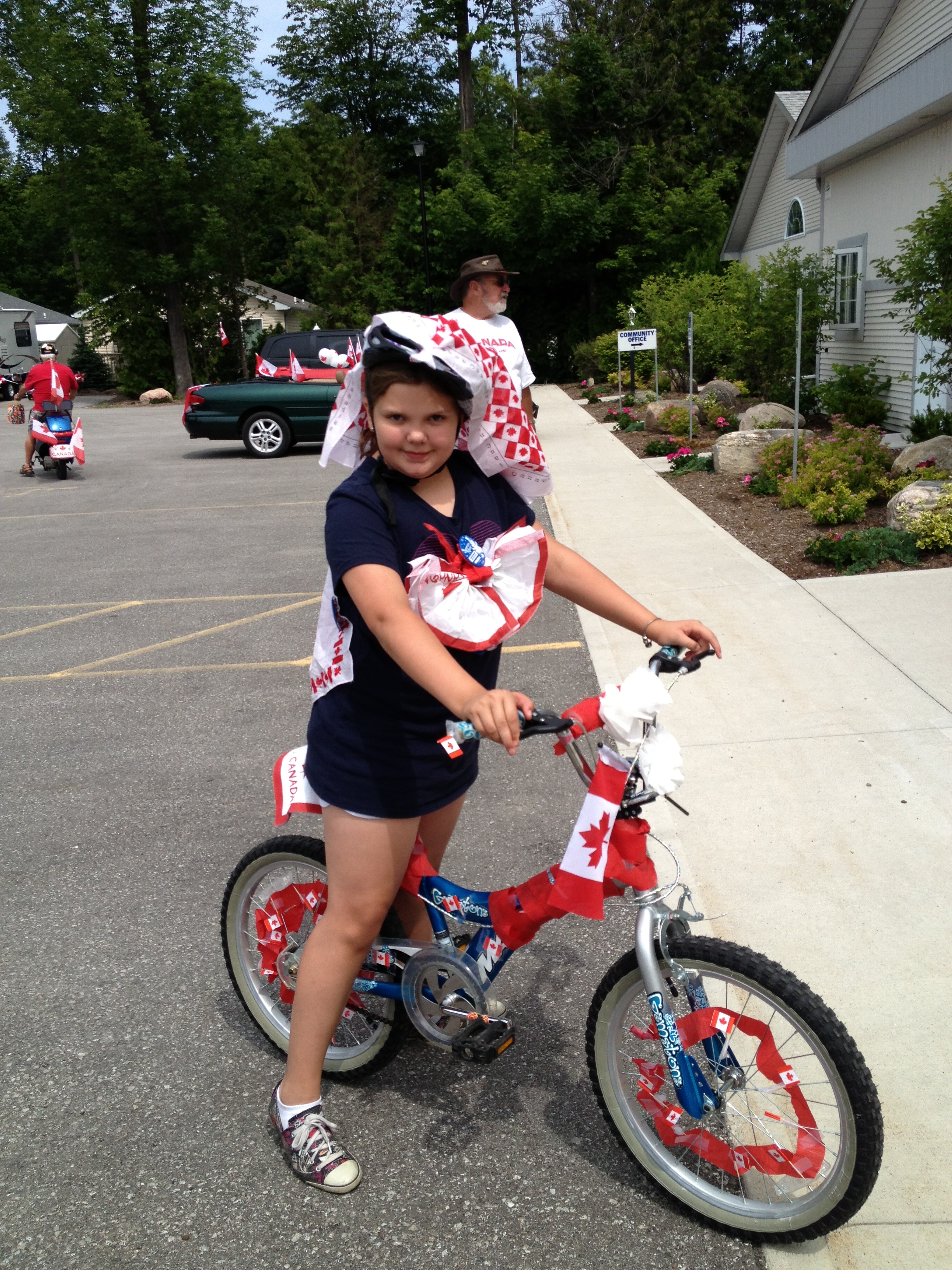 Emily and her bike she decorated for the parade